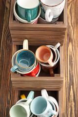 Wooden boxes with ceramic tea cups