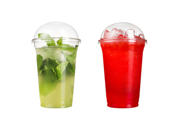 Delicious fruit smoothies in plastic cups, on a white background. Two cocktails with berry flavor and mahito.
