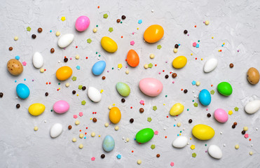 Chocolate Eggs and Sprinkles on Grey Background, Sweet Easter Treat