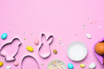 Easter Concept, Cookie Cutters, Eggs, Sugar Sprinkles and Chocolate Eggs on Bright Background