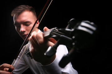 Young men playing the violin