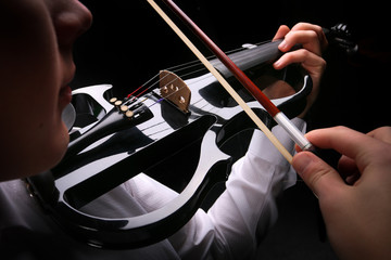 Young men playing the violin