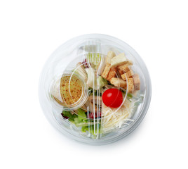 Container with delicious food for delivery on white background