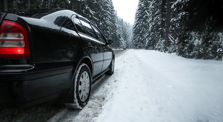 Car on road at snowy winter resort