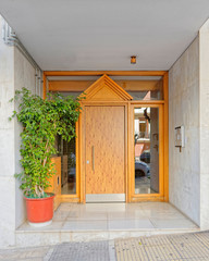 Fototapeta na wymiar Greece Athens downtown, 60's elegant condominium entrance metallic door