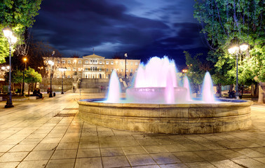 Building of Greek parliament in Syntagma square - fountain, Athens, Greece