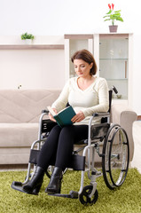 Woman in wheelchair at home 