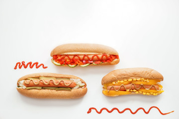 Tasty hot dogs on white background