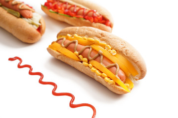 Tasty hot dogs on white background