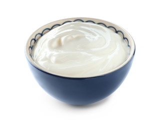 Bowl with tasty yogurt on white background