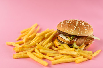 urger with fries. takeaway lunch, fast food restaurant, fast food menu. pink  background, selective focus and copy space