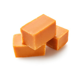Tasty sweet caramel on white background