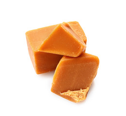 Tasty sweet caramel on white background