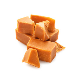 Tasty sweet caramel on white background