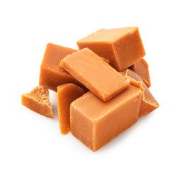 Tasty sweet caramel on white background