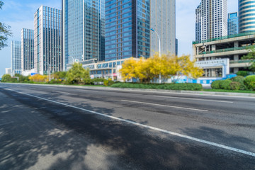 empty asphalt road front of modern buildings.