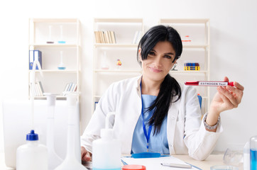 Female chemist working at the lab  