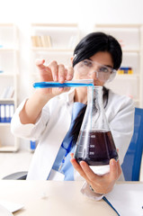 Female chemist working at the lab  