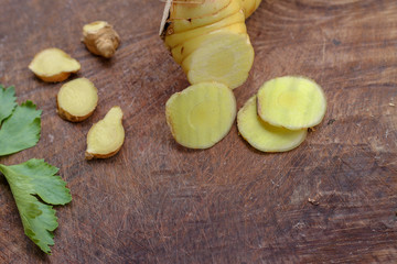 Galangal cut into thin strips with celery leaves.