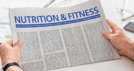 Man reading newspaper with the headline Nutrition and Fitness