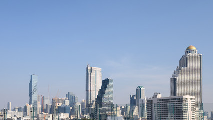 Cityscape with skyscraper building and blue sky at bangkok