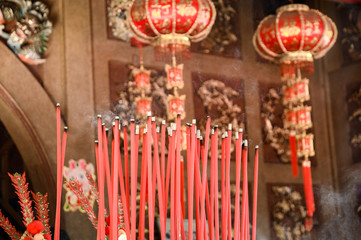 Burning big red incense in temple