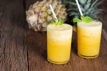 Tropical drink, Pineapple smoothie in glass with fresh pineapple.