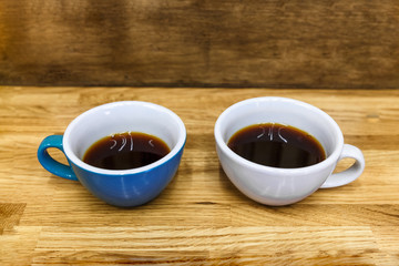 Two cups of black coffee