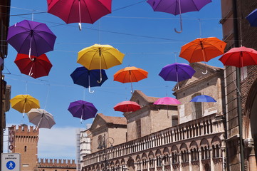 Giuseppe Mazzini street with hanging umbrellas, Ferrara, Italy