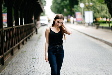 young girl posing on a street in the city