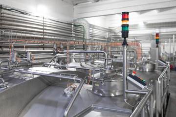 Chrome pipes and traffic lights. Industrial background
