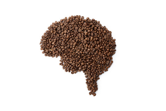 Human brain made with coffee beans. Concept image Using coffee for brain for ideas. Useful image to illustrate ideas, creative, thinking. Food concept top view isolated on white background