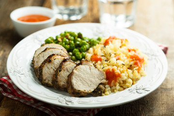 Pork with bulgur and green pea