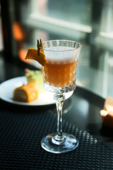 Delicious mango cocktail with egg white foam