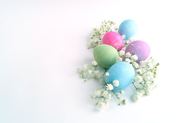 Easter color painted eggs on a white background.