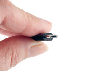 USB cable in the hands, isolated, closeup