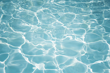 Texture of water in swimming pool for background