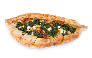 Traditional turkish pizza pide with spinach isolated on white. Top view.