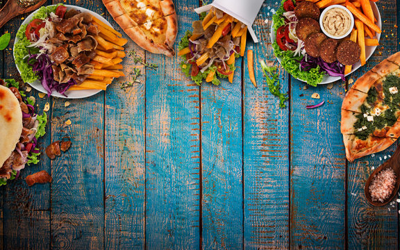 Top down view on traditional turkish meals on vintage wooden table. Close-up.