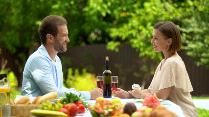 Happily married having glasses of wine in own country house, credit financing