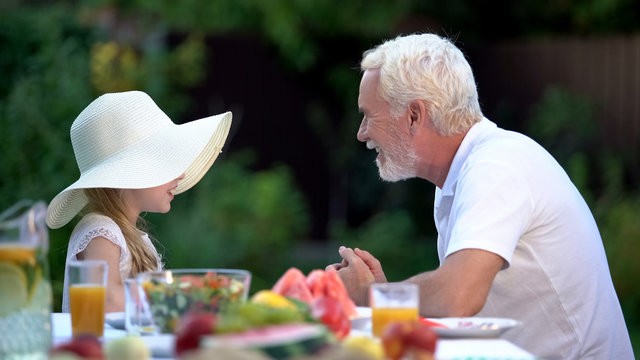 Girl Telling Exciting Story To Grandfather, Spending Time Together, Relationship