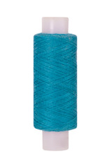 Turquoise sewing thread reel on white isolated background