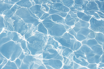 Texture of water in swimming pool for background