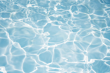 Texture of water in swimming pool for background