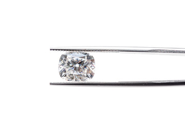 Big Carat Diamond in Tweezers onWhite Background