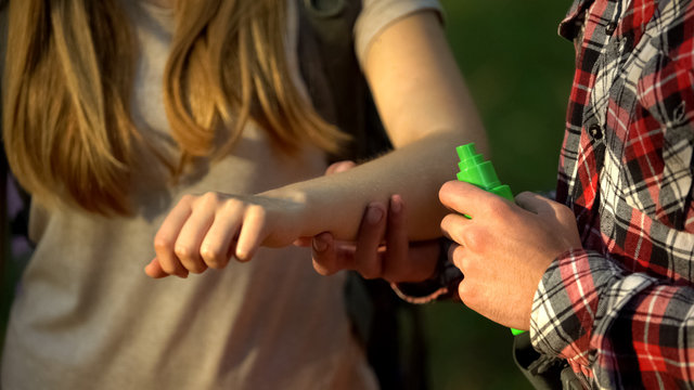 Man Applying Cooling Cream On Ladys Arm After Mosquitoes Bite, Insect Repellent