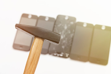 Hammer, broken screen and new phone screen on white background. Phone repair concept. Toned