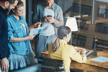 Office teamwork situation. Group of people and general tasks in the workspace