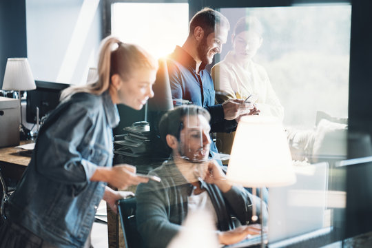 Office teamwork situation. Group of people talking and working on daily general tasks in the workplace