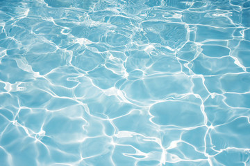 Texture of water in swimming pool for background